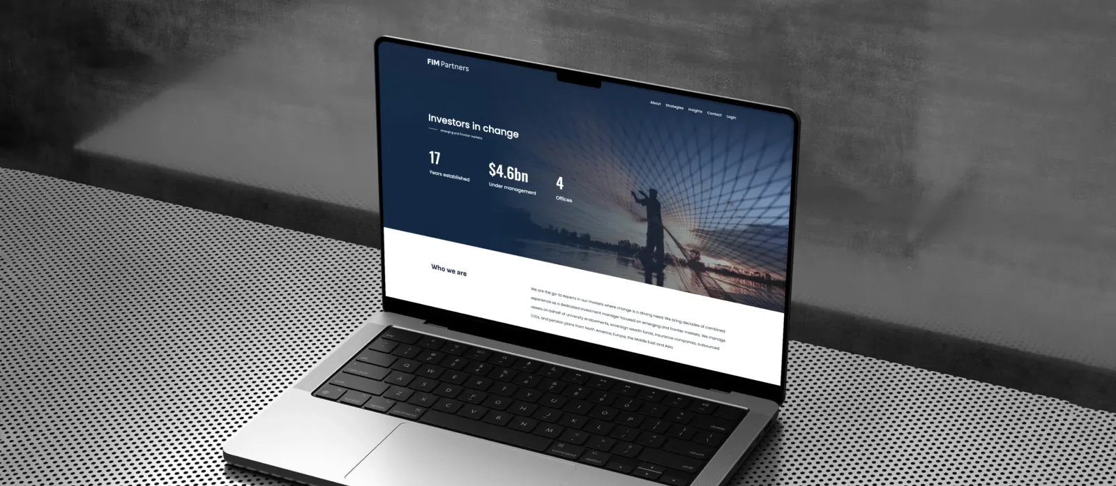 FIM Partners website on laptop