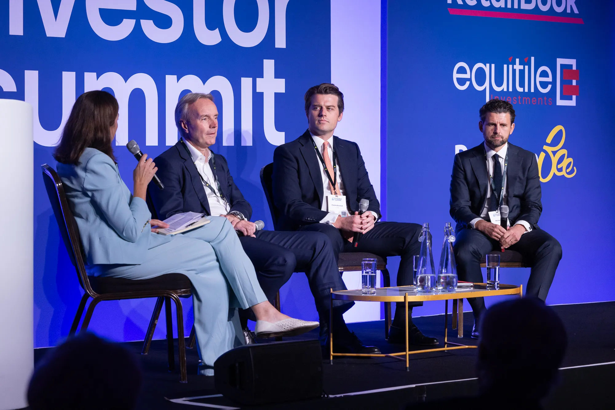 Panellists in conversation on the Investor Summit main stage